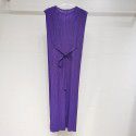 Pleated mid length dress exudes a slimming and slimming look, with a lace up skirt